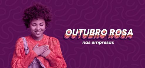 Mulher de cabelo cacheado e pele negra colocando a mão sobre o peito. Ela veste uma roupa laranja por baixo de um macacão. Do lado direito dela, está escrito 'Outubro Rosa nas empresas'.