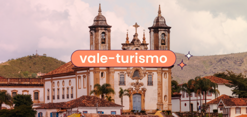 Imagem de uma das igrejas de Ouro Preto, Minas Gerais. No centro da imagem há o título "vale-turismo".